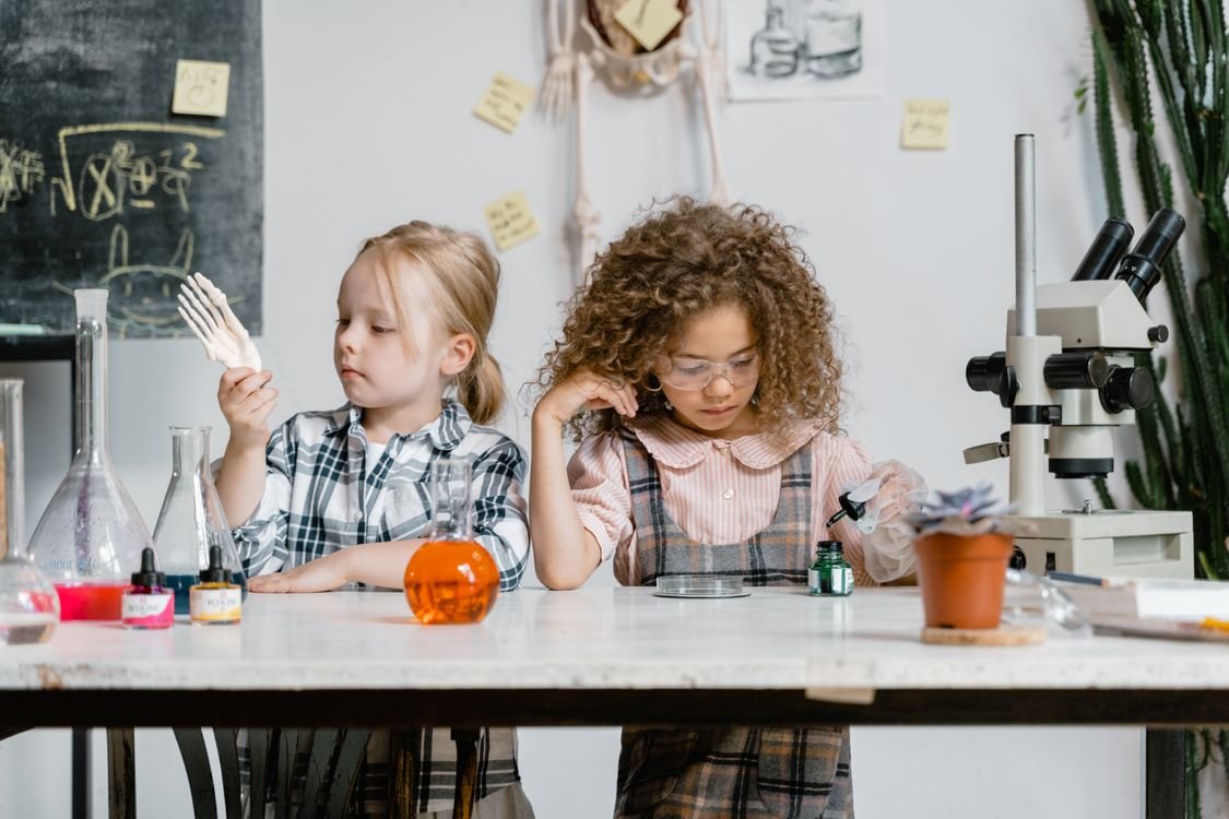 Kids doing a science experiment at home - kitchen science activities for children